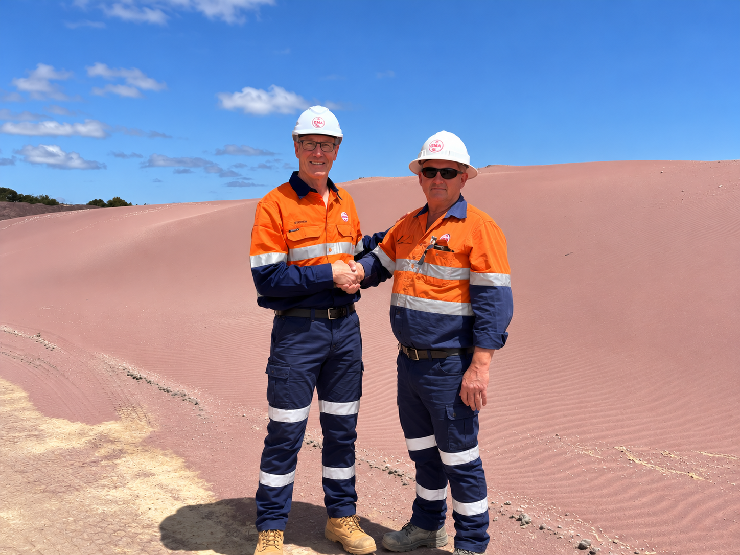GMA Mining Team Handshake in the Dunes